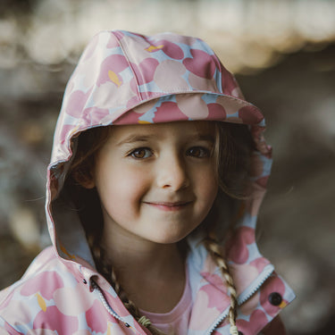 Head shot showing Snapper Rock raincoat hood with brim