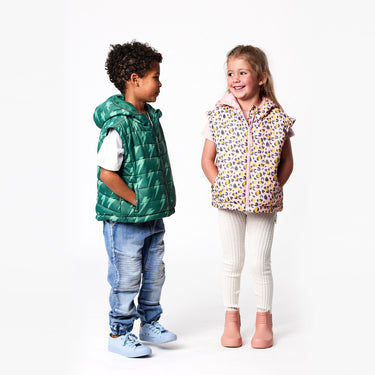 Boy and girl wearing Snapper Rock kids puffer vests.